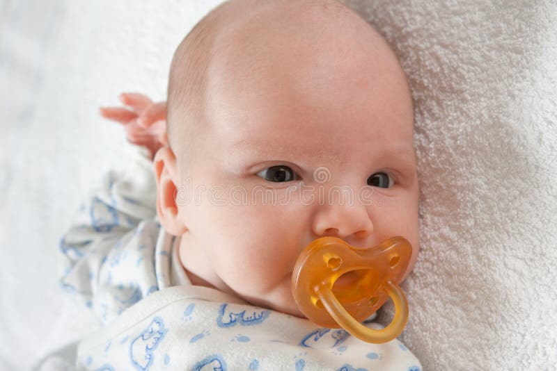 Newborn baby with soother stock image. Image of cute 13184985