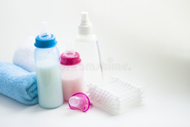 Newborn baby story. Towels and children's toys, scissors, baby bottle, nipple, hairbrush on white background royalty free stock images Newborn baby story. Towels and children's toys, scissors, baby bottle, nipple, hairbrush on white background royalty free stock images