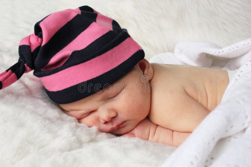 Newborn baby with stripy hat