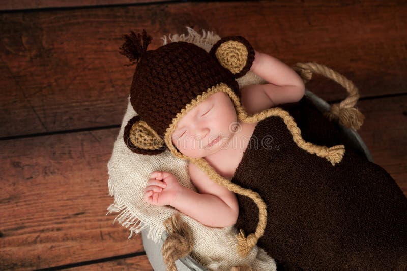 Newborn Baby Wearing a Monkey Hat