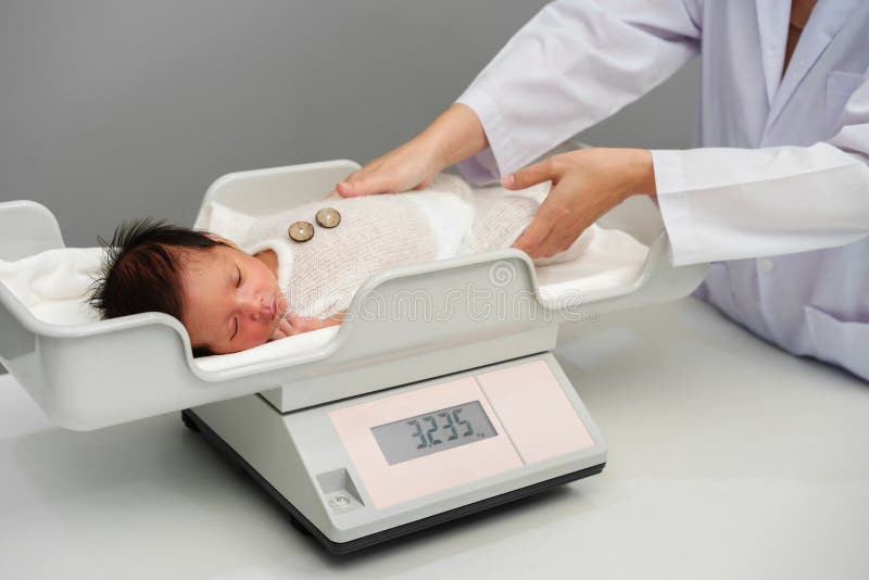 Weighing a Newborn Baby on a Scale in a Maternity Hospital, Isolated O  Stock Photo - Image of white, medicine: 276647452