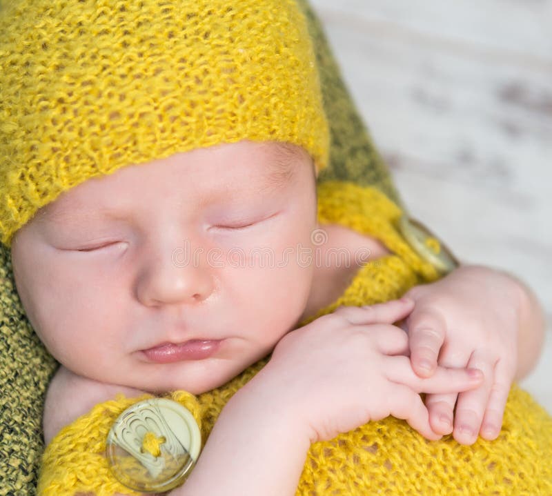 Newborn Baby in Yellow Costume Sleeping on Wooden Cot Stock Image ...
