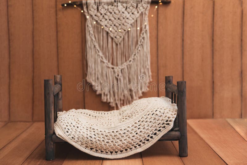 Newborn background - wooden bed with rustic throw and macrame