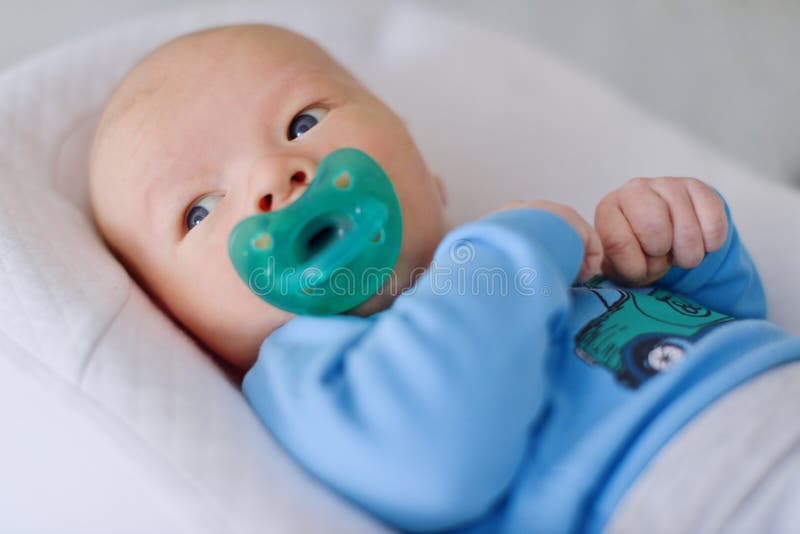 Newborn with dummy royalty free stock images