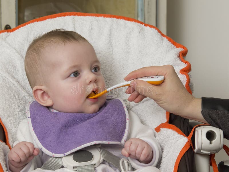 Newborn eating stock image. Image of grimace, spoon, testing 50979479
