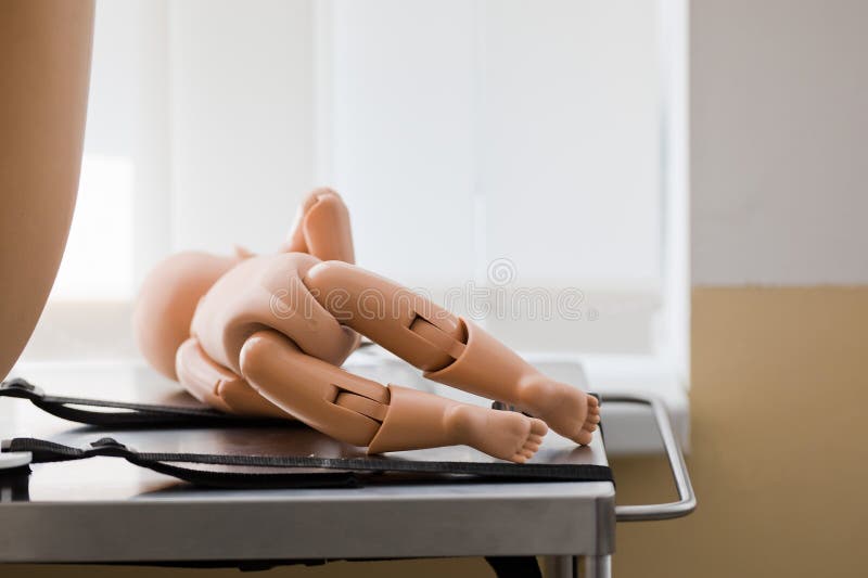 Newborn mannequin, model for childbirth simulation on table. Little marionette stock images, royalty-free photos and pictures