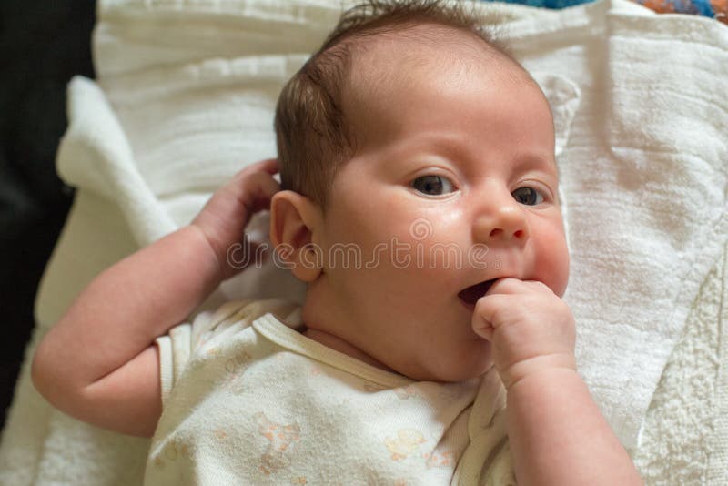 The Newborn One Month Old Baby Lying on the Bed Stock Photo Image of