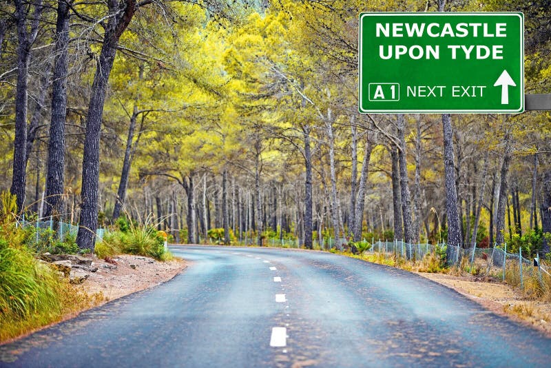 NEWCASTLE upon TYDE Road Sign Against Clear Blue Sky Stock Image
