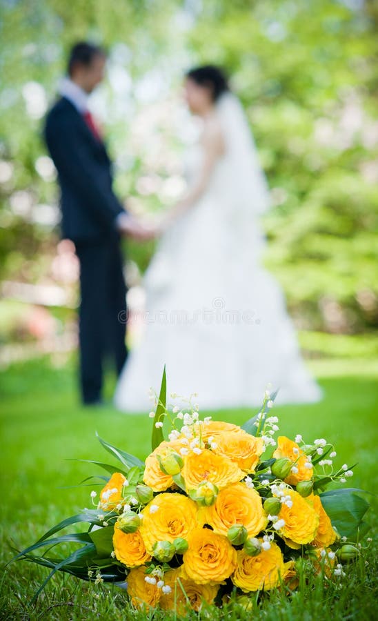 Newlymarried Couple And Wedding Bouquet In The Fo Stock Photo Image