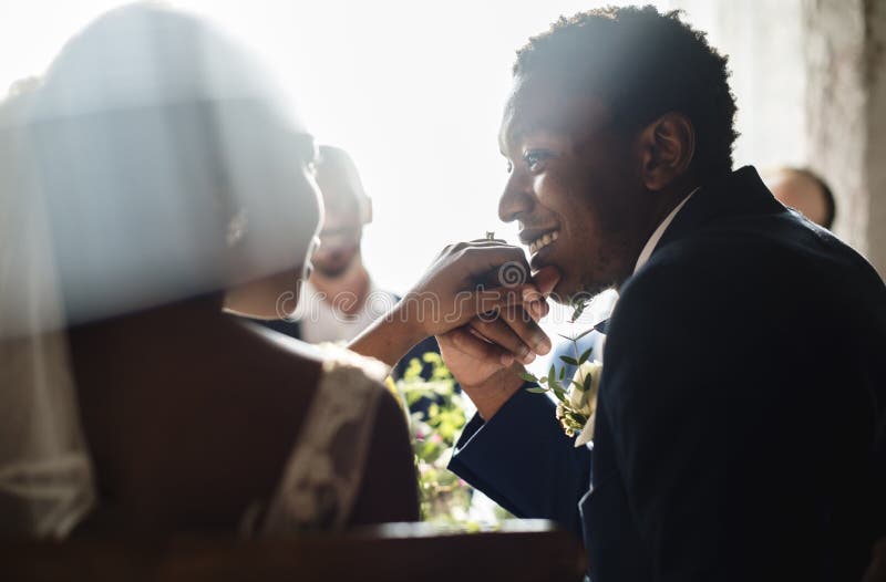 Newlywed African Descent Couple Kissing Hands royalty free stock image Newlywed African Descent Couple Kissing Hands royalty free stock image