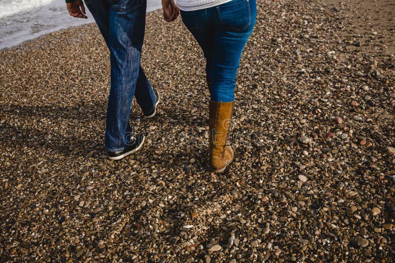 Newlywed couple walking on the beach royalty free stock images Newlywed couple walking on the beach royalty free stock images