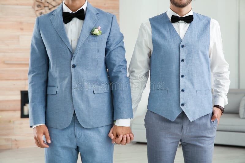 Newlywed gay couple holding hands royalty free stock photography Newlywed gay couple holding hands royalty free stock photography