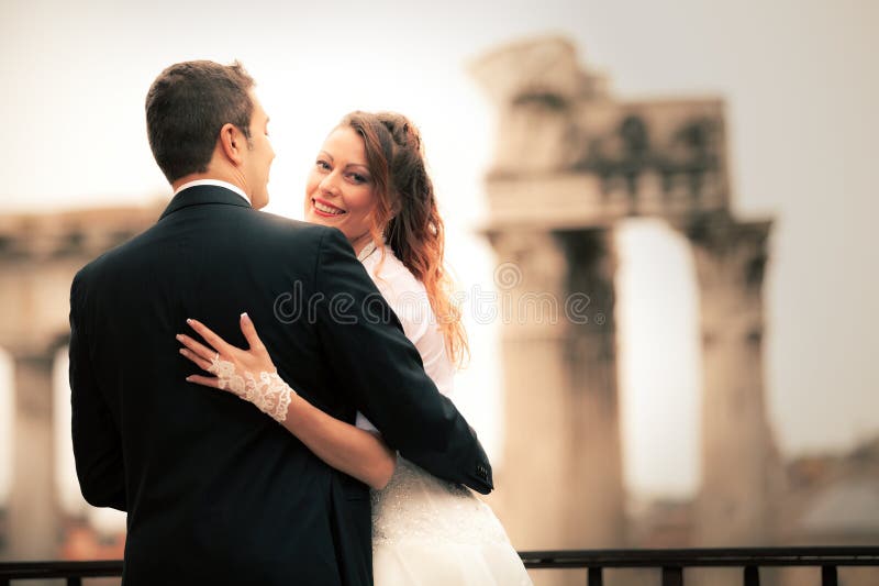 Newlyweds in the ancient city. Happy married couple. Rome, Italy. royalty free stock photography Newlyweds in the ancient city. Happy married couple. Rome, Italy. royalty free stock photography