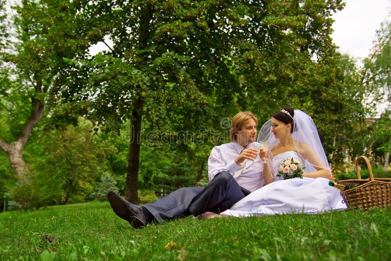 Newlyweds drinking wine