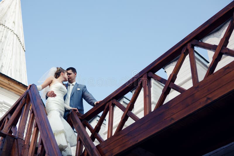Newlyweds on the stairs stock image