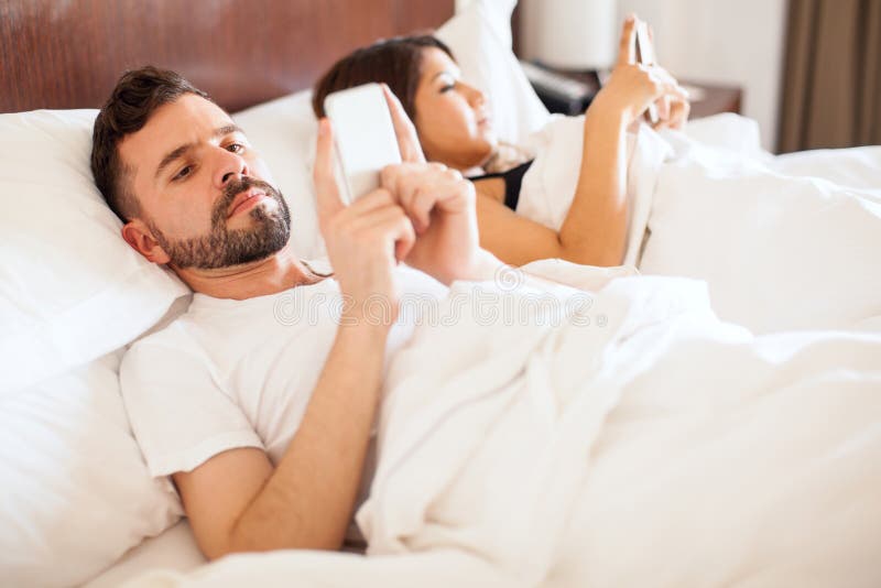 Newlyweds texting in bed stock image. Image of honeymoon - 76666707 Google Couple Texting In Bed R 34