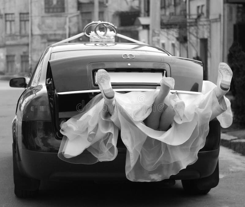 Newlyweds in wedding car