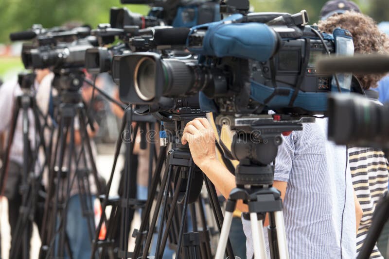 News conference. Filming an event with a video camera.