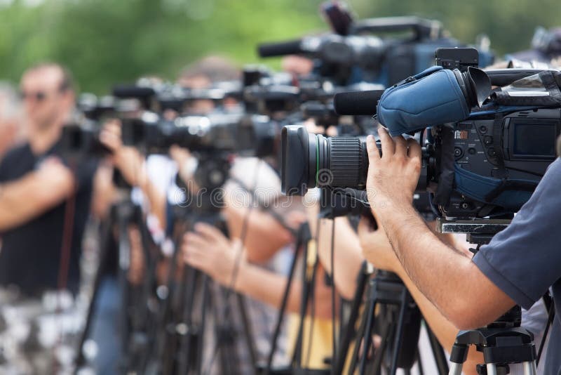 News conference. Filming an event with a video camera.