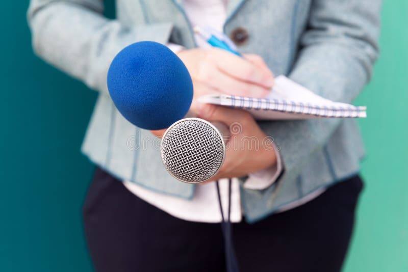 News Reporter Or Tv Journalist At Press Conference Holding Microphone