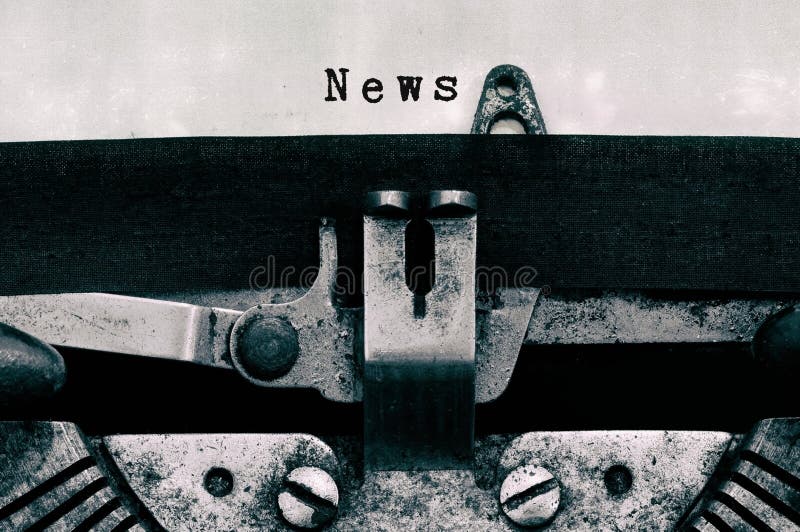 News words typed on a vintage typewriter stock image News words typed on a vintage typewriter stock image