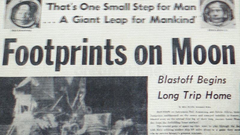 Newspaper Announcing First Footsteps on the Moon stock photos