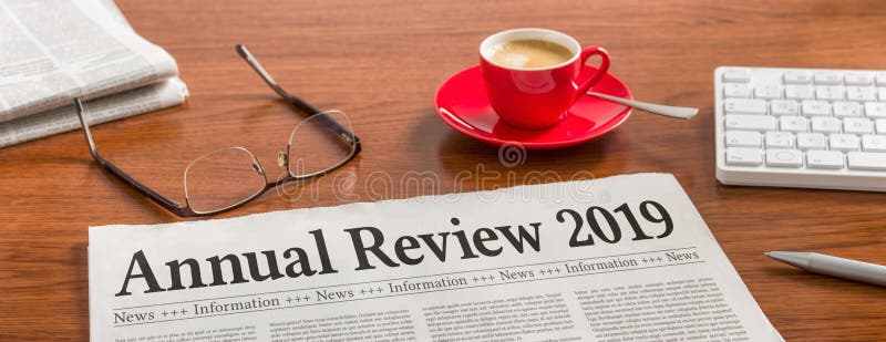 A newspaper on a wooden desk - Annual review 2019 stock photography A newspaper on a wooden desk - Annual review 2019 stock photography