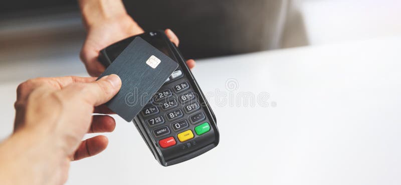 Nfc contactless payment by credit card and pos terminal royalty free stock photos