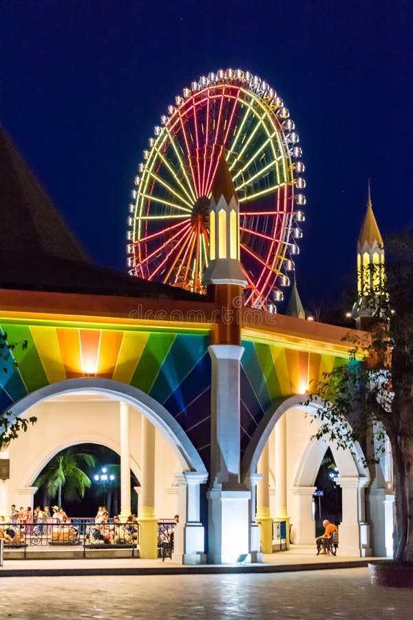 NHA TRANG, VIETNAM - APRIL 16, 2019: Glowing Ferris wheel at night at the amusement park Vinpearl royalty free stock photo NHA TRANG, VIETNAM - APRIL 16, 2019: Glowing Ferris wheel at night at the amusement park Vinpearl royalty free stock photo