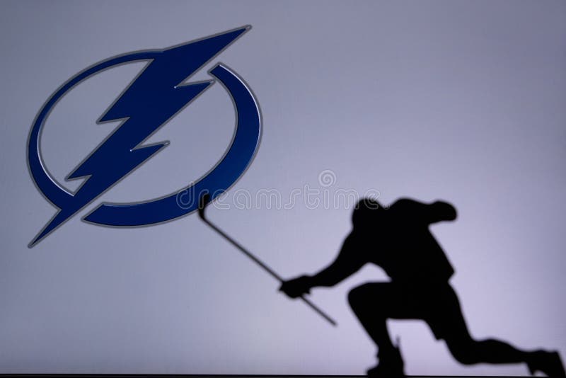 TORONTO, CANADA, 17. JULY: Tampa Bay Lightning Logo. Professional NHL hockey player celebrate goal. Silhouette photo, Edit space. TORONTO, CANADA, 17. JULY: Tampa Bay Lightning Logo. Professional NHL hockey player celebrate goal. Silhouette photo, Edit space