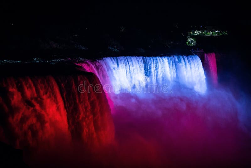 NIagara Falls Illuminated with Color Lights at Night Stock Image