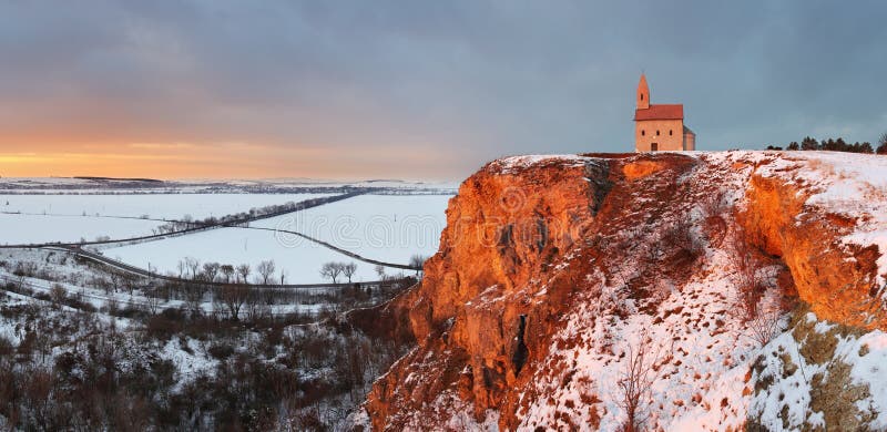 Nice Catholic Chapel in eastern Europe at winter landscape - village Drazovce