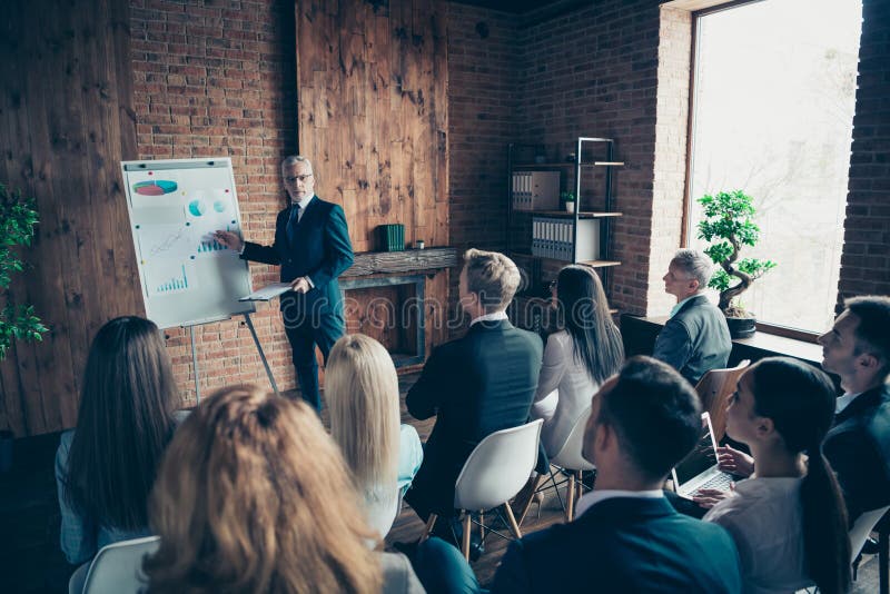 Nice classy stylish trendy serious sharks attending corporate forum listening to top management company ceo boss chief