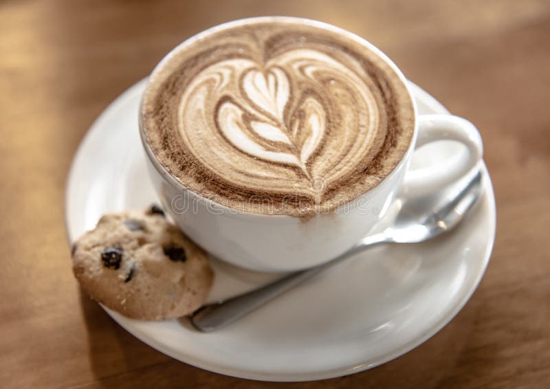 Nice coffee latte with cookie royalty free stock image