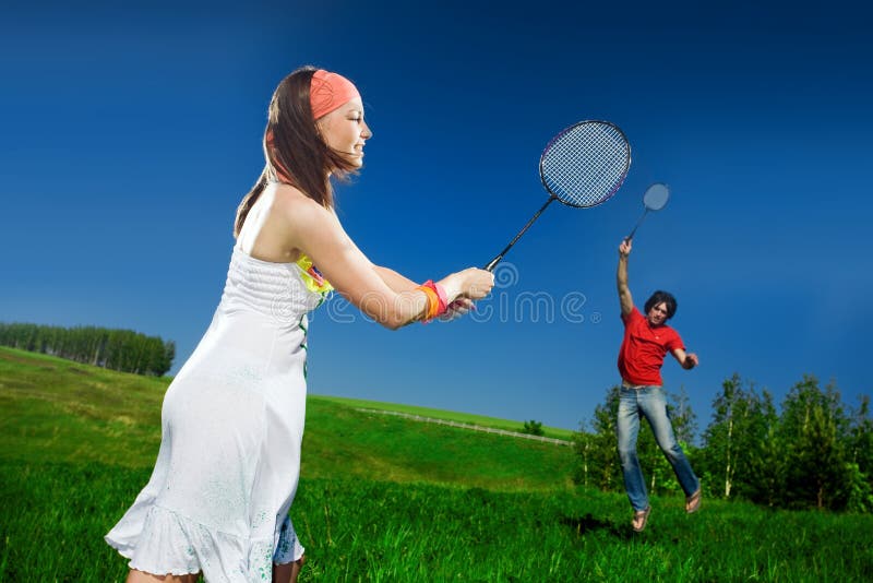 Nice girl and boy with rackets