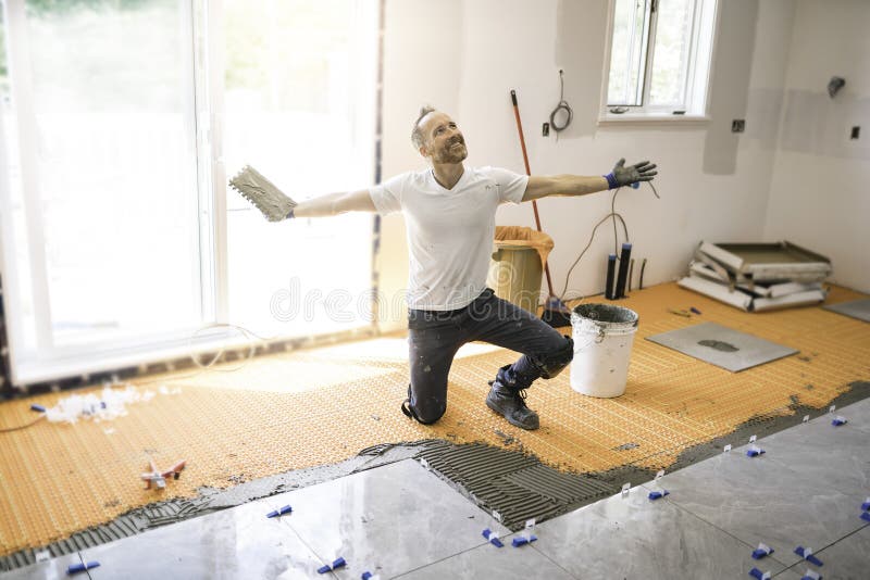 Nice Handyman Install Tile on the Floor Stock Image Image of