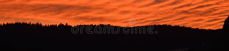 Wonderful landscape at end of the day. Sunset on the mountain ridges. Beautiful landscape with bright red blood color.