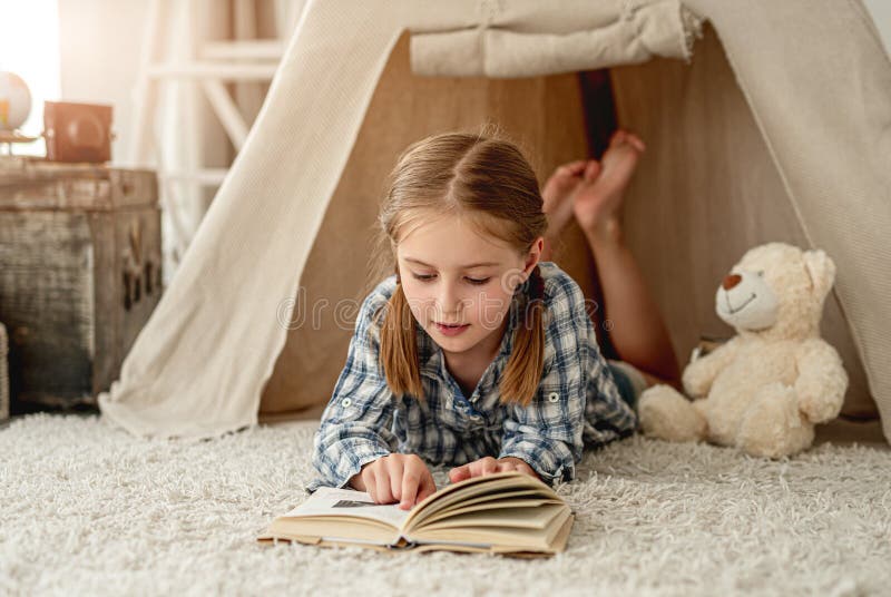 Nice little girl with paper book