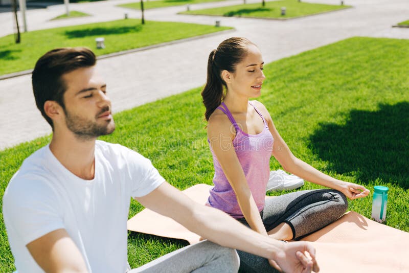 Nice pleasant people sitting with their eyes closed stock image Nice pleasant people sitting with their eyes closed stock image