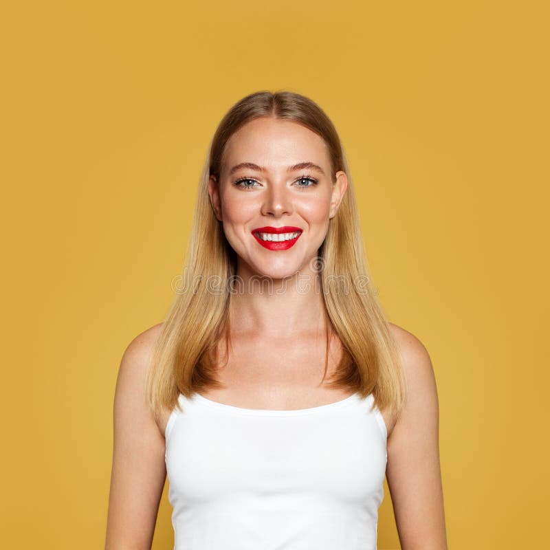 Nice positive woman on yellow background. Portrait, positive emotion stock image