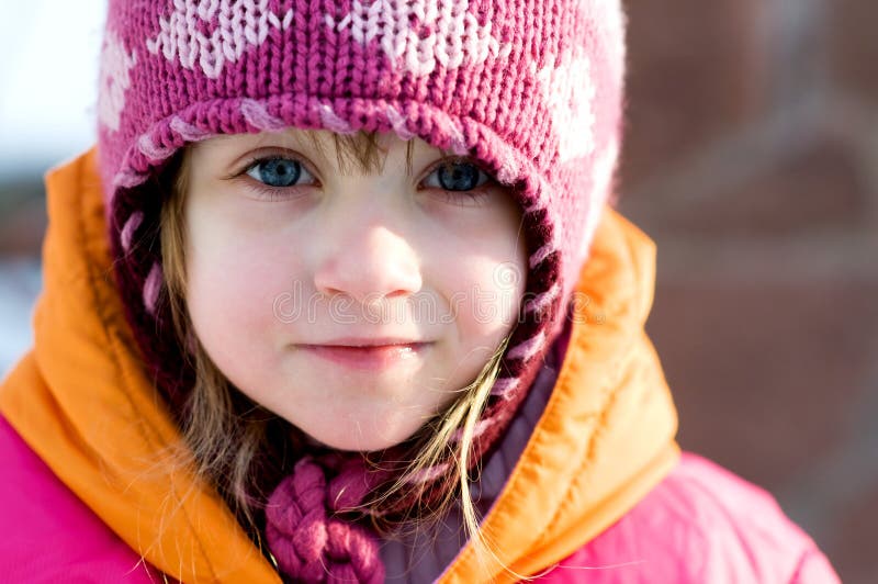 Nice toddler girl in winter pink hat