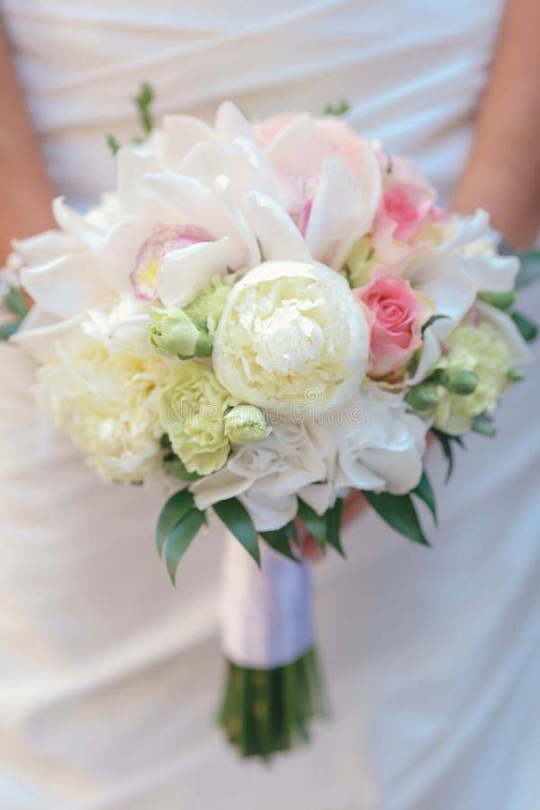 Nice wedding bouquet in bride`s hand royalty free stock photo Nice wedding bouquet in bride`s hand royalty free stock photo