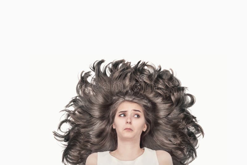 Nice young girl with luxurious blond hair on a white background stock photography Nice young girl with luxurious blond hair on a white background stock photography