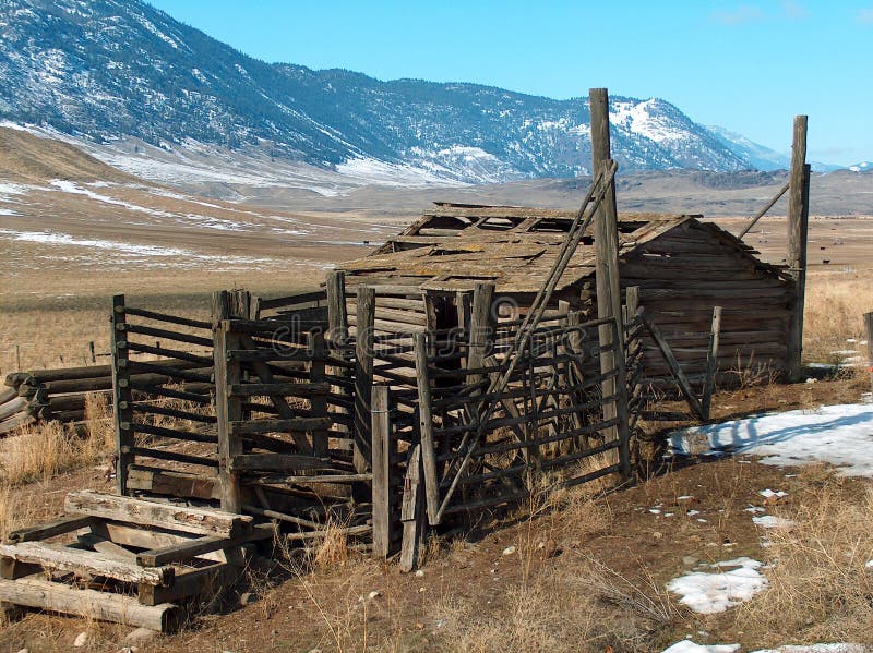 An old log homestead barn and corral in the Okanogan Hills, Okanogan county, Washington state. An old log homestead barn and corral in the Okanogan Hills, Okanogan county, Washington state.