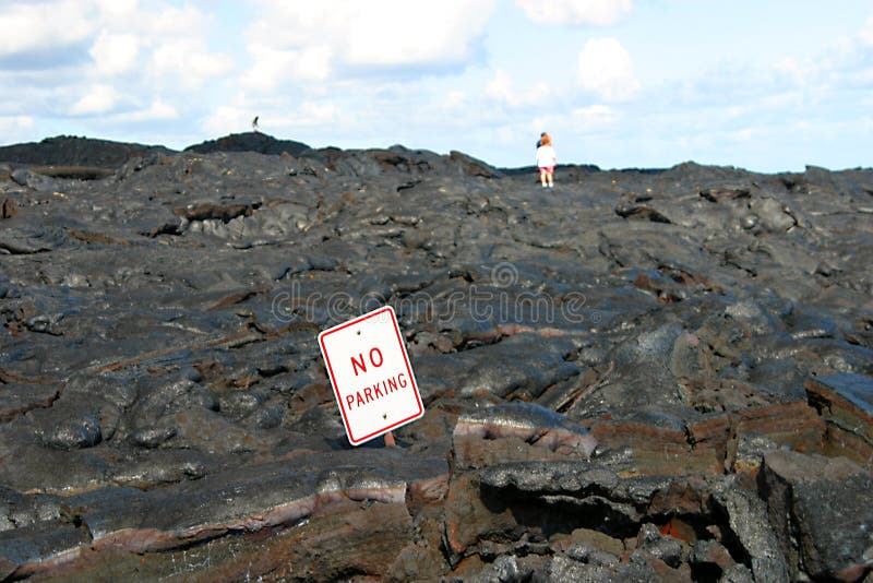 There definitely will be no parking here. An April 2003 lava flow on the Big Island of Hawaii left this sign buried. There definitely will be no parking here. An April 2003 lava flow on the Big Island of Hawaii left this sign buried.