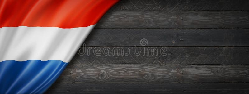 Niederländische Flagge auf schwarzem Holz Wandbanner stockfotografie