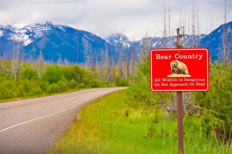 Bear Country Warning Sign. All Wildlife is Dangerous. Do Not Approach or Feed Red Countryside Sign. Montana, United States. Bear Country Warning Sign. All Wildlife is Dangerous. Do Not Approach or Feed Red Countryside Sign. Montana, United States.