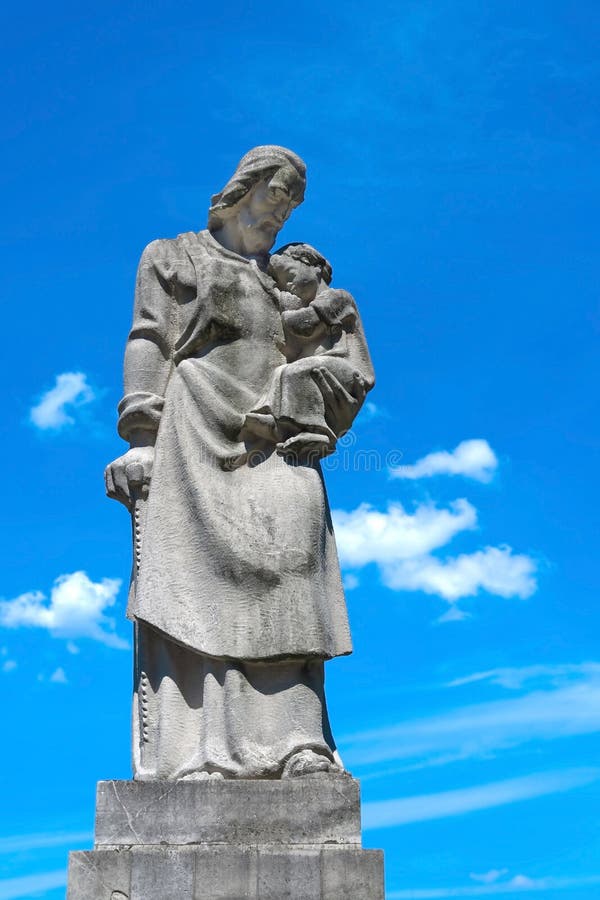 Statue of Saint Joseph with the Baby Jesus. Niepokalanow - City of the Immaculate Mother of God, apr. 40 km to the west from Warsaw, Poland - consists of the Franciscan church and monastery founded in 1927 by Father Maximilian Kolbe. Father Kolbe was arrested by the Germans and taken to Auschwitz during the World War 2, where he gave his life for another inmate. He was canonized as a saint-martyr of the Catholic Church in 1982. The monument was designed by Faldyga-Solska in 1944. Statue of Saint Joseph with the Baby Jesus. Niepokalanow - City of the Immaculate Mother of God, apr. 40 km to the west from Warsaw, Poland - consists of the Franciscan church and monastery founded in 1927 by Father Maximilian Kolbe. Father Kolbe was arrested by the Germans and taken to Auschwitz during the World War 2, where he gave his life for another inmate. He was canonized as a saint-martyr of the Catholic Church in 1982. The monument was designed by Faldyga-Solska in 1944