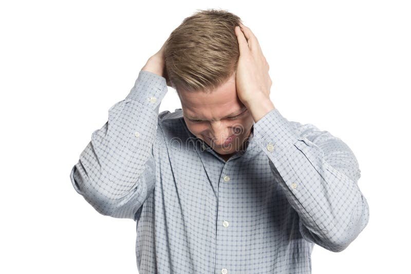 Failure concept: Desperate businessman looking down with both hands at head isolated on white background. Failure concept: Desperate businessman looking down with both hands at head isolated on white background.