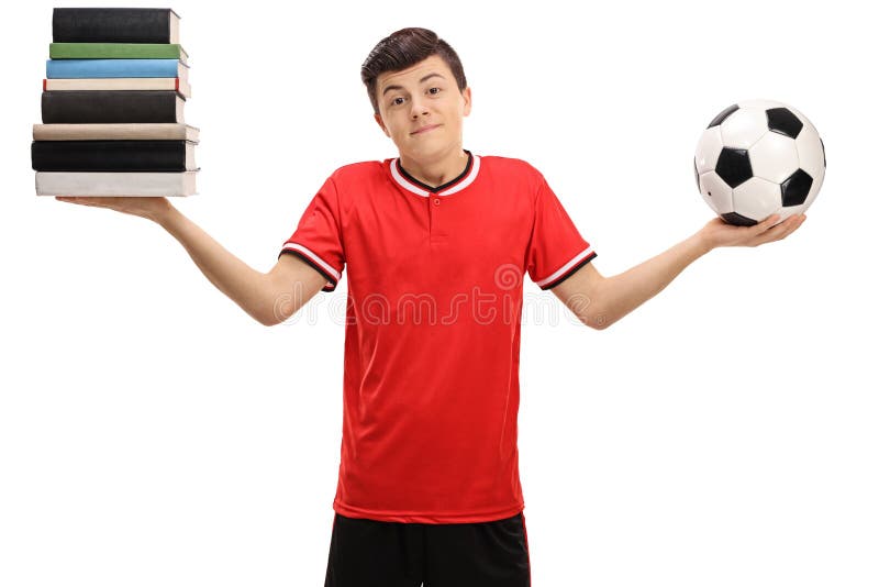 Indecisive teenage boy holding a stack of books and a football isolated on white background. Indecisive teenage boy holding a stack of books and a football isolated on white background